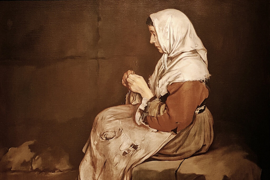 Fotografia di un particolare dell'opera "Donna che fa la calza" di Giacomo Ceruti